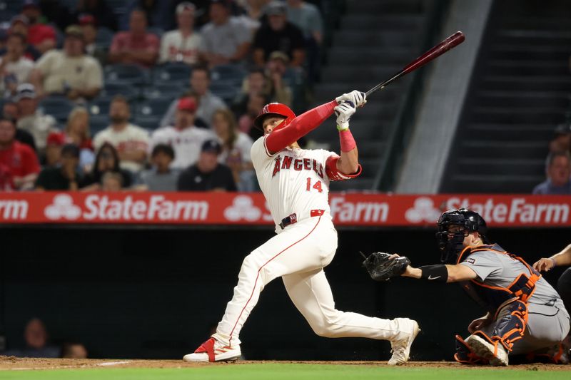 Jun 28, 2024; Anaheim, California, USA;  Los Angeles Angels catcher Logan O'Hoppe (14) hits a three-run home run during the eighth inning against the Detroit Tigers at Angel Stadium. Mandatory Credit: Kiyoshi Mio-USA TODAY Sports