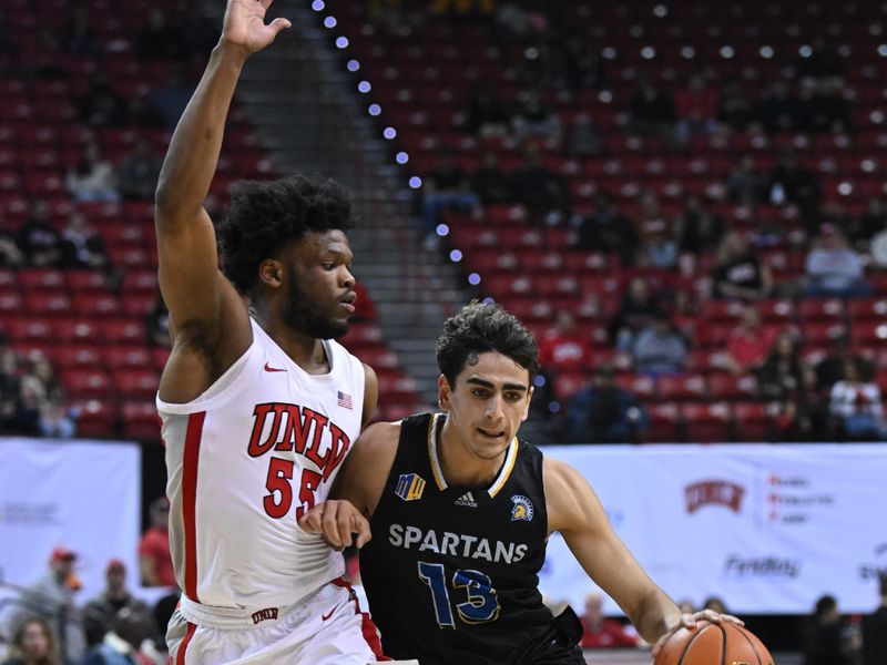 Feb 14, 2023; Las Vegas, Nevada, USA; UNLV Runnin' Rebels guard EJ Harkless (55) defends against San Jose State Spartans guard Alvaro Cardenas (13) in the second half at Thomas & Mack Center. Mandatory Credit: Candice Ward-USA TODAY Sports