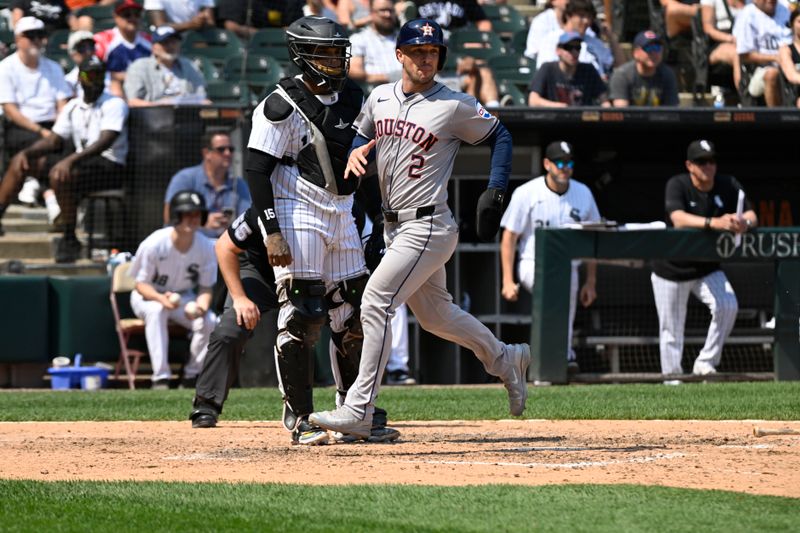 Jun 20, 2024; Chicago, Illinois, USA;  Houston Astros third base Alex Bregman (2) scores in the  during the seventh inning against the Chicago White Sox at Guaranteed Rate Field. Mandatory Credit: Matt Marton-USA TODAY Sports