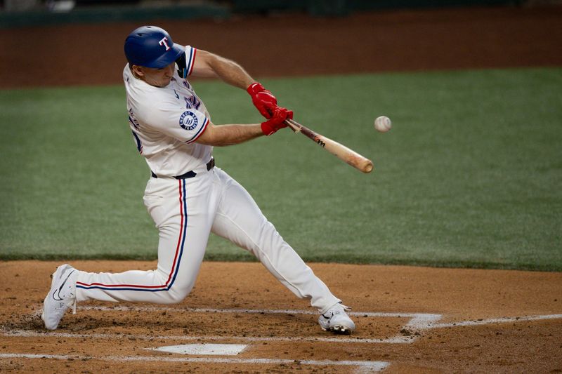Aug 21, 2024; Arlington, Texas, USA; Texas Rangers left fielder Wyatt Langford (36) bats against the Pittsburgh Pirates during the second inning at Globe Life Field. Mandatory Credit: Jerome Miron-USA TODAY Sports