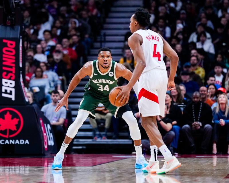 TORONTO, ON - JANUARY 6: Giannis Antetokounmpo #34 of the Milwaukee Bucks guards Scottie Barnes #4 of the Toronto Raptors during the second half at the Scotiabank Arena on January 6, 2025 in Toronto, Ontario, Canada. NOTE TO USER: User expressly acknowledges and agrees that, by downloading and/or using this Photograph, user is consenting to the terms and conditions of the Getty Images License Agreement. (Photo by Kevin Sousa/Getty Images)