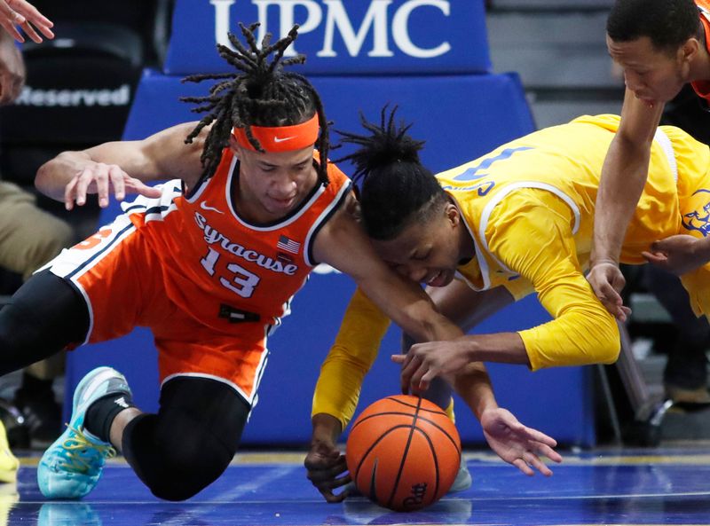 Jan 16, 2024; Pittsburgh, Pennsylvania, USA; Syracuse Orange forward Benny Williams (13) and Pittsburgh Panthers guard Carlton Carrington (7) fight for a loose ball during the second half at the Petersen Events Center. Syracuse won 69-58. Mandatory Credit: Charles LeClaire-USA TODAY Sports