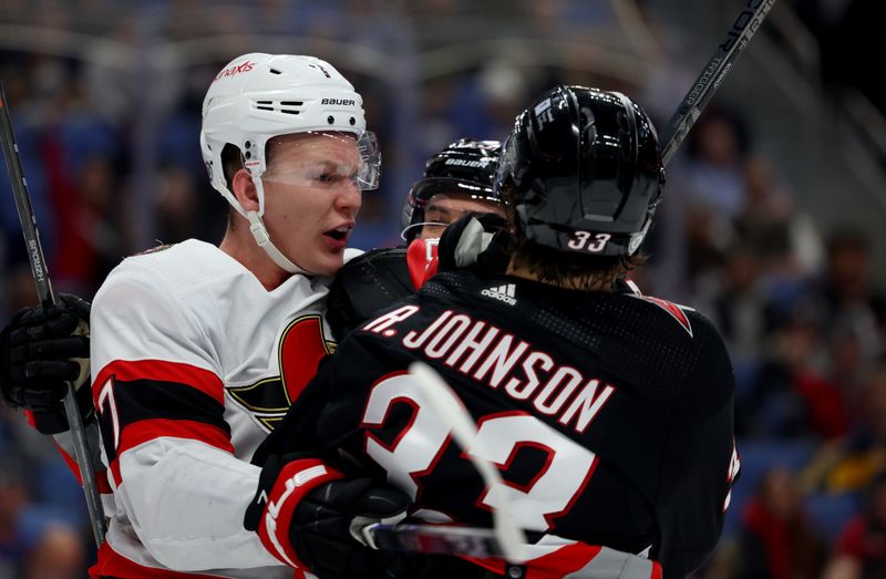 Jan 11, 2024; Buffalo, New York, USA;  Ottawa Senators left wing Brady Tkachuk (7) and Buffalo Sabres defenseman Ryan Johnson (33) get into a scrum after a whistle during the second period at KeyBank Center. Mandatory Credit: Timothy T. Ludwig-USA TODAY Sports