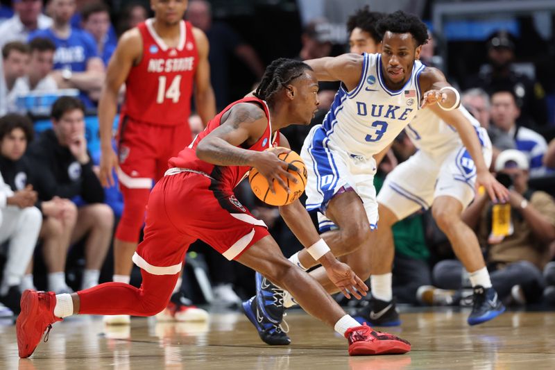 Mar 31, 2024; Dallas, TX, USA; North Carolina State Wolfpack guard DJ Horne (0) controls the ball against Duke Blue Devils guard Jeremy Roach (3) in the first half in the finals of the South Regional of the 2024 NCAA Tournament at American Airline Center. Mandatory Credit: Kevin Jairaj-USA TODAY Sports