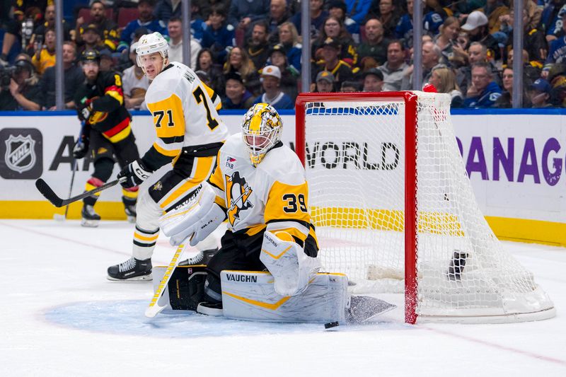 Oct 26, 2024; Vancouver, British Columbia, CAN; Pittsburgh Penguins goalie Alex Nedeljkovic (39) makes a save against the Vancouver Canucks during the first period at Rogers Arena. Mandatory Credit: Bob Frid-Imagn Images