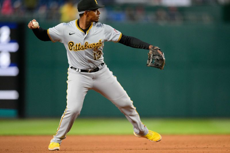 Apr 4, 2024; Washington, District of Columbia, USA; Pittsburgh Pirates third baseman Ke'Bryan Hayes (13) throws to first base during the eighth inning against the Washington Nationals at Nationals Park. Mandatory Credit: Reggie Hildred-USA TODAY Sports