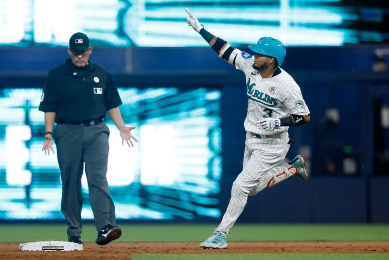 Sep 15, 2023; Miami, Florida, USA; Miami Marlins second baseman Luis Arraez (3) hits a home run against the Atlanta Braves during the first inning at loanDepot Park. Mandatory Credit: Rhona Wise-USA TODAY Sports