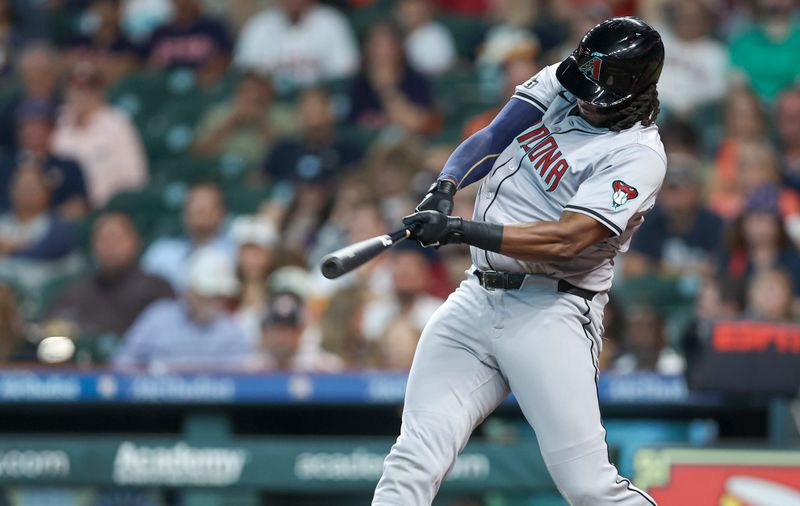 Sep 8, 2024; Houston, Texas, USA; Arizona Diamondbacks first baseman Josh Bell (36) hits a single during the third inning against the Houston Astros at Minute Maid Park. Mandatory Credit: Troy Taormina-Imagn Images