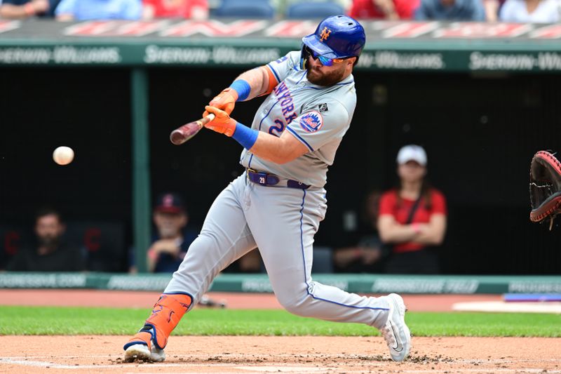 May 22, 2024; Cleveland, Ohio, USA; New York Mets right fielder DJ Stewart (29) hits a single during the first inning against the Cleveland Guardians at Progressive Field. Mandatory Credit: Ken Blaze-USA TODAY Sports

