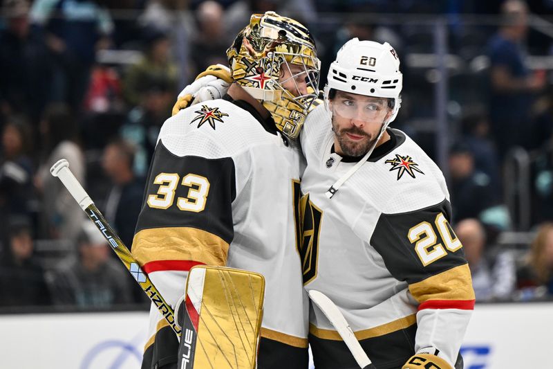 Oct 15, 2022; Seattle, Washington, USA; Vegas Golden Knights goaltender Adin Hill (33) and center Chandler Stephenson (20) celebrate after a win against the Seattle Kraken at Climate Pledge Arena. Mandatory Credit: Steven Bisig-USA TODAY Sports