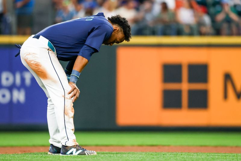 Aug 8, 2024; Seattle, Washington, USA; Seattle Mariners second baseman Jorge Polanco (7) reacts following the final out of the the seventh inning against the Detroit Tigers at T-Mobile Park. Mandatory Credit: Joe Nicholson-USA TODAY Sports