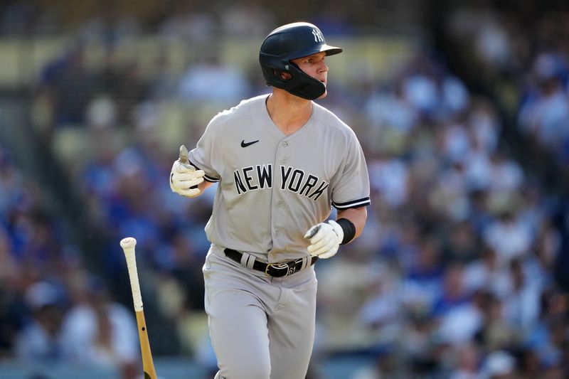 Jun 3, 2023; Los Angeles, California, USA; New York Yankees left fielder Jake Bauers (61) follows through on a home run in the fourth inning against the Los Angeles Dodgers at Dodger Stadium. Mandatory Credit: Kirby Lee-USA TODAY Sports