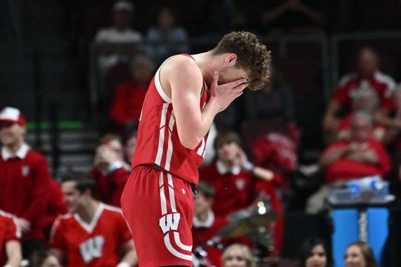 Mar 28, 2023; Las Vegas, NV, USA; Wisconsin Badgers guard Max Klesmit (11) reacts to a foul call against the North Texas Mean Green in the first half at Orleans Arena. Mandatory Credit: Candice Ward-USA TODAY Sports