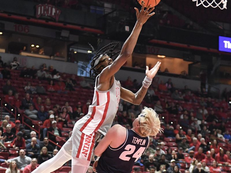 Jan 13, 2024; Las Vegas, Nevada, USA; UNLV Rebels forward Keylan Boone (20) tries to score on Utah State Aggies forward Karson Templin (24) in the first half at Thomas & Mack Center. Mandatory Credit: Candice Ward-USA TODAY Sports