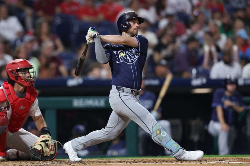 Sep 11, 2024; Philadelphia, Pennsylvania, USA; Tampa Bay Rays second base Brandon Lowe (8) hits a triple during the third inning against the Philadelphia Phillies at Citizens Bank Park. Mandatory Credit: Bill Streicher-Imagn Images