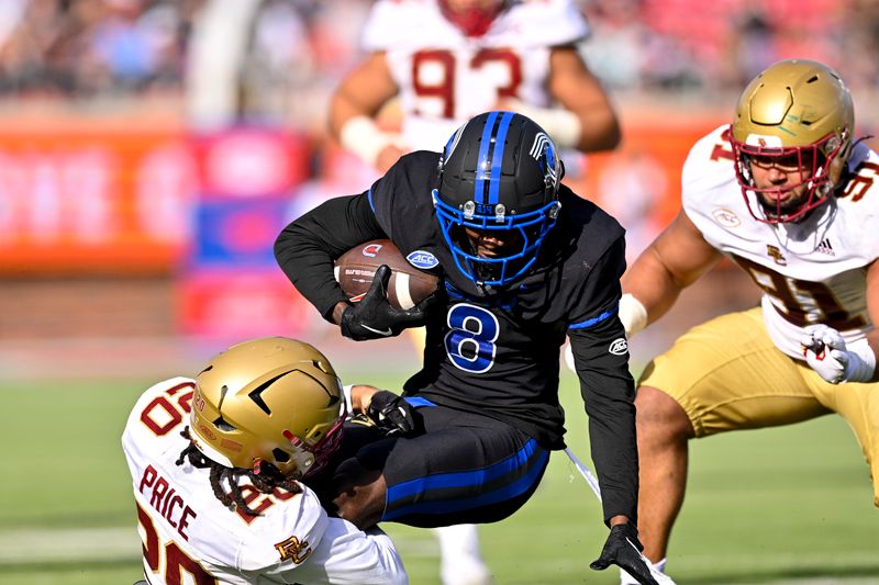 Nov 16, 2024; Dallas, Texas, USA; SMU Mustangs wide receiver Jordan Hudson (8) catches a pass for a first down as he is tackled by Boston College Eagles defensive back KP Price (20) during the first half at the Gerald J. Ford Stadium. Mandatory Credit: Jerome Miron-Imagn Images