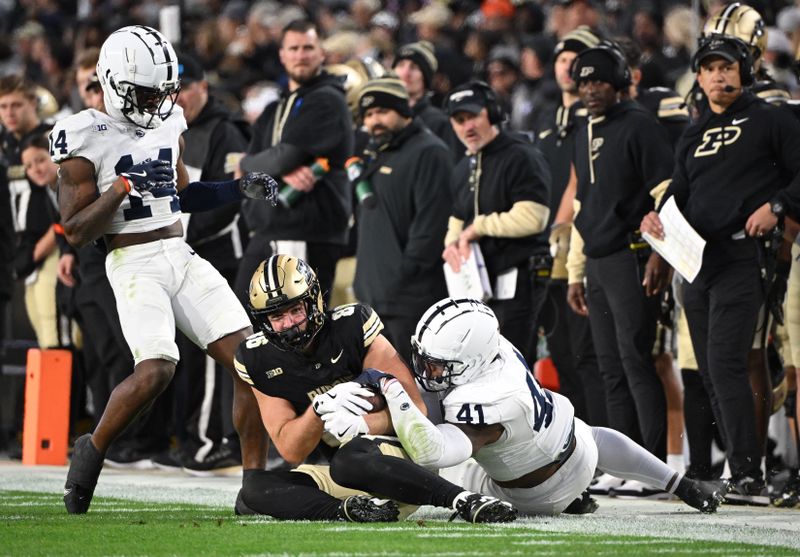 Nov 16, 2024; West Lafayette, Indiana, USA; Purdue Boilermakers tight end Max Klare (86) is tackled by Penn State Nittany Lions linebacker Kobe King (41) during the second half at Ross-Ade Stadium. Mandatory Credit: Marc Lebryk-Imagn Images