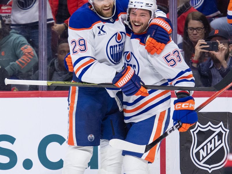 Oct 21, 2025; Ottawa, Ontario, CAN; Edmonton Oilers left wing Isaac Howarrd (53) celebrates with center Leon Draisaitl (29) after a goal in the second period against the Ottawa Senators at the Canadian Tire Centre. Mandatory Credit: Marc DesRosiers-IMAGN Images