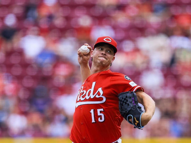 Aug 17, 2025; Cincinnati, Ohio, USA; Cincinnati Reds relief pitcher Emilio Pagan (15) pitches in the ninth inning against the Milwaukee Brewers at Great American Ball Park. Mandatory Credit: Katie Stratman-Imagn Images