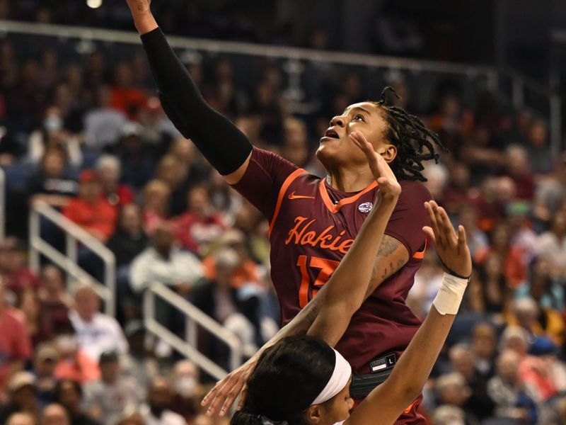 Mar 5, 2023; Greensboro, NC, USA; Virginia Tech Hokies forward Taylor Soule (13) shoots over Louisville Cardinals forward Olivia Cochran (44) during the second half at Greensboro Coliseum. Mandatory Credit: William Howard-USA TODAY Sports