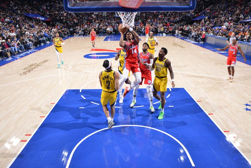 PHILADELPHIA, PA - DECEMBER 13: Ricky Council IV #14 of the Philadelphia 76ers drives to the basket during the game against the Indiana Pacers on December 13, 2024 at the Wells Fargo Center in Philadelphia, Pennsylvania NOTE TO USER: User expressly acknowledges and agrees that, by downloading and/or using this Photograph, user is consenting to the terms and conditions of the Getty Images License Agreement. Mandatory Copyright Notice: Copyright 2024 NBAE (Photo by Jesse D. Garrabrant/NBAE via Getty Images)