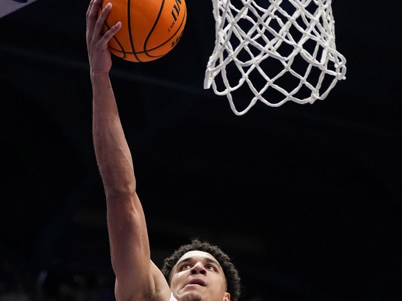 Jan 6, 2024; Lawrence, Kansas, USA; Kansas Jayhawks guard Kevin McCullar Jr. (15) shoots a layup during the second half against the TCU Horned Frogs at Allen Fieldhouse. Mandatory Credit: Jay Biggerstaff-USA TODAY Sports