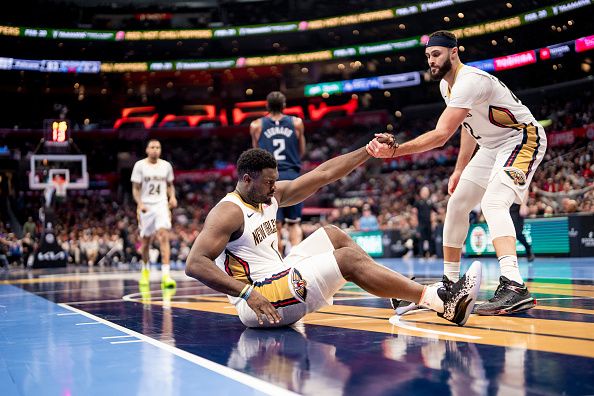 LOS ANGELES, CA - NOVEMBER 24: Zion Williamson #1 of the New Orleans Pelicans is helped up by Larry Nance Jr. #22 during the game against the LA Clippers during the In-Season Tournament on November 24, 2023 at Crypto.Com Arena in Los Angeles, California. NOTE TO USER: User expressly acknowledges and agrees that, by downloading and/or using this Photograph, user is consenting to the terms and conditions of the Getty Images License Agreement. Mandatory Copyright Notice: Copyright 2023 NBAE (Photo by Tyler Ross/NBAE via Getty Images)