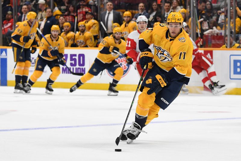 Mar 23, 2024; Nashville, Tennessee, USA; Nashville Predators center Mark Jankowski (17) skates the puck into the offensive zone during the third period against the Detroit Red Wings at Bridgestone Arena. Mandatory Credit: Christopher Hanewinckel-USA TODAY Sports