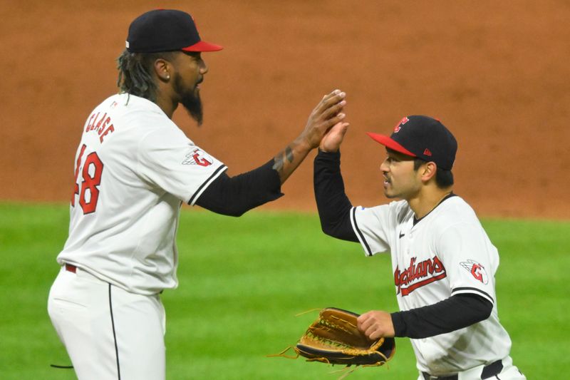 Apr 20, 2024; Cleveland, Ohio, USA; Cleveland Guardians relief pitcher Emmanuel Clase (48) and left fielder Steven Kwan (38) celebrate a win over the Oakland Athletics at Progressive Field. Mandatory Credit: David Richard-USA TODAY Sports