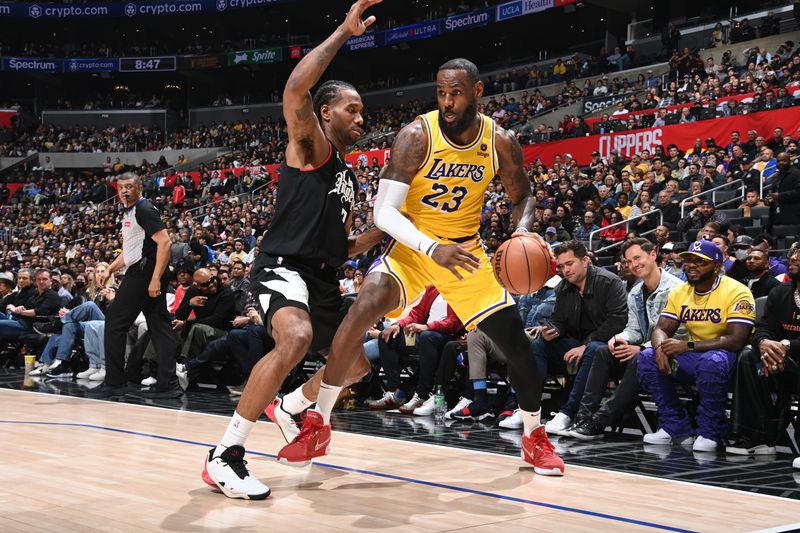 LOS ANGELES, CA - FEBRUARY 28: LeBron James #23 of the Los Angeles Lakers dribbles the ball during the game against the LA Clippers on February 28, 2024 at Crypto.Com Arena in Los Angeles, California. NOTE TO USER: User expressly acknowledges and agrees that, by downloading and/or using this Photograph, user is consenting to the terms and conditions of the Getty Images License Agreement. Mandatory Copyright Notice: Copyright 2024 NBAE (Photo by Andrew D. Bernstein/NBAE via Getty Images)