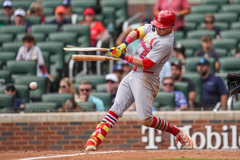 Apr 23, 2025; Cumberland, Georgia, USA; St. Louis Cardinals outfielder Lars Nootbaar (21) breaks his bat while grounding out against the Atlanta Braves during the ninth inning at Truist Park. Mandatory Credit: Dale Zanine-Imagn Images