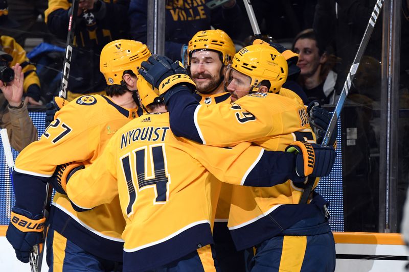 Apr 4, 2024; Nashville, Tennessee, USA; Nashville Predators defenseman Roman Josi (59) celebrates with teammates after a goal during the first period against the St. Louis Blues at Bridgestone Arena. Mandatory Credit: Christopher Hanewinckel-USA TODAY Sports