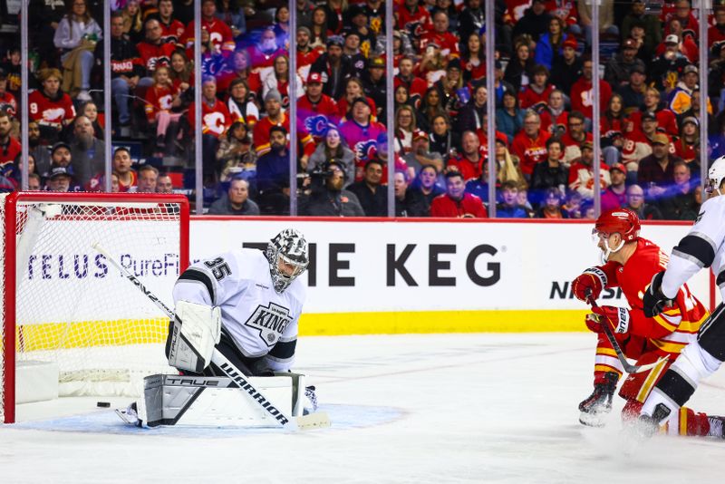 Nov 11, 2024; Calgary, Alberta, CAN; Calgary Flames center Jonathan Huberdeau (10) scores a goal against the Los Angeles Kings goaltender Darcy Kuemper (35) during the second period at Scotiabank Saddledome. Mandatory Credit: Sergei Belski-Imagn Images