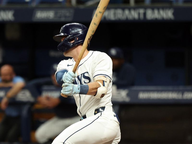 Sep 3, 2024; St. Petersburg, Florida, USA;  Tampa Bay Rays outfielder Jonny DeLuca (21) singles against the Minnesota Twins during the second inning at Tropicana Field. Mandatory Credit: Kim Klement Neitzel-Imagn Images