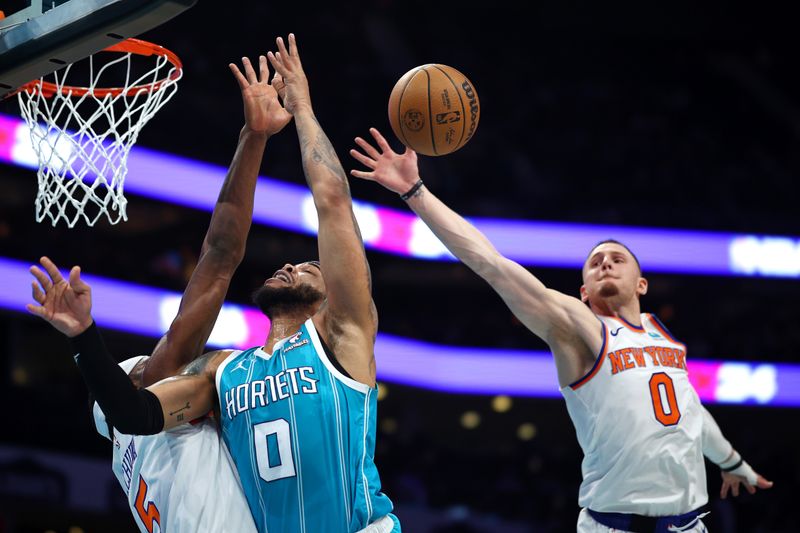 CHARLOTTE, NORTH CAROLINA - JANUARY 29: Donte DiVincenzo #0 of the New York Knicks blocks a shot attempt from Miles Bridges #0 of the Charlotte Hornets during the first half of the game at Spectrum Center on January 29, 2024 in Charlotte, North Carolina. NOTE TO USER: User expressly acknowledges and agrees that, by downloading and or using this photograph, User is consenting to the terms and conditions of the Getty Images License Agreement. (Photo by Jared C. Tilton/Getty Images)