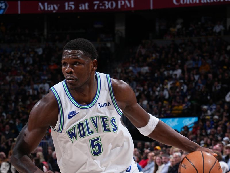 DENVER, CO - MARCH 29: Anthony Edwards #5 of the Minnesota Timberwolves dribbles the ball during the game against the Denver Nuggets on March 29, 2024 at the Ball Arena in Denver, Colorado. NOTE TO USER: User expressly acknowledges and agrees that, by downloading and/or using this Photograph, user is consenting to the terms and conditions of the Getty Images License Agreement. Mandatory Copyright Notice: Copyright 2024 NBAE (Photo by Garrett Ellwood/NBAE via Getty Images)