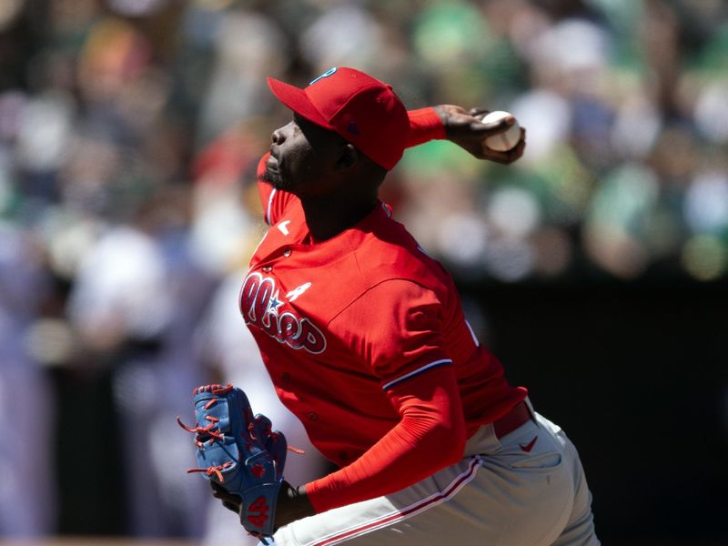 Jun 18, 2023; Oakland, California, USA; Philadelphia Phillies pitcher Yunior Marte (43) delivers a pitch against the Oakland Athletics during the ninth inning at Oakland-Alameda County Coliseum. Mandatory Credit: D. Ross Cameron-USA TODAY Sports