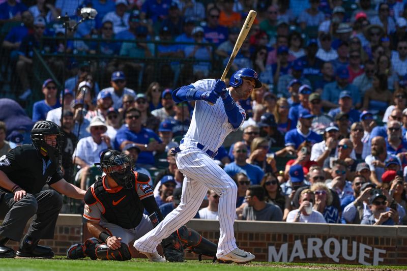 Sep 6, 2023; Chicago, Illinois, USA;  Chicago Cubs center fielder Cody Bellinger (24) hits an RBI double against the San Francisco Giants during the third inning at Wrigley Field. Mandatory Credit: Matt Marton-USA TODAY Sports