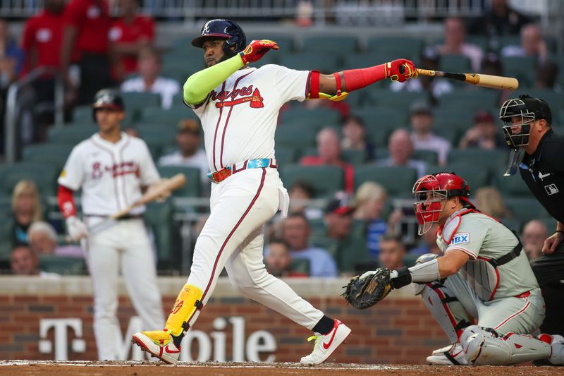 Aug 21, 2024; Atlanta, Georgia, USA; Atlanta Braves designated hitter Marcell Ozuna (20) hits a single against the Philadelphia Phillies in the third inning at Truist Park. Mandatory Credit: Brett Davis-USA TODAY Sports
