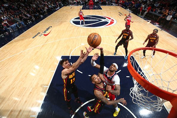 WASHINGTON, DC -? DECEMBER 31: Dejounte Murray #5 of the Atlanta Hawks grabs a rebound during the game against the Washington Wizards on December 31, 2023 at Capital One Arena in Washington, DC. NOTE TO USER: User expressly acknowledges and agrees that, by downloading and or using this Photograph, user is consenting to the terms and conditions of the Getty Images License Agreement. Mandatory Copyright Notice: Copyright 2023 NBAE (Photo by Stephen Gosling/NBAE via Getty Images)