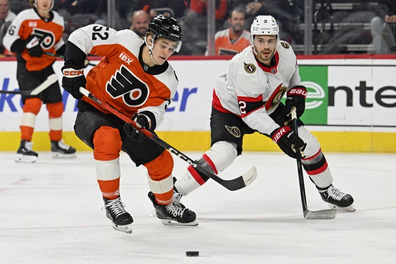 Feb 5, 2026; Philadelphia, Pennsylvania, USA; Philadelphia Flyers center Denver Barkey (52) tries to control the puck against Ottawa Senators defenseman Artem Zub (2) during the first period at Xfinity Mobile Arena. Mandatory Credit: Eric Hartline-Imagn Images