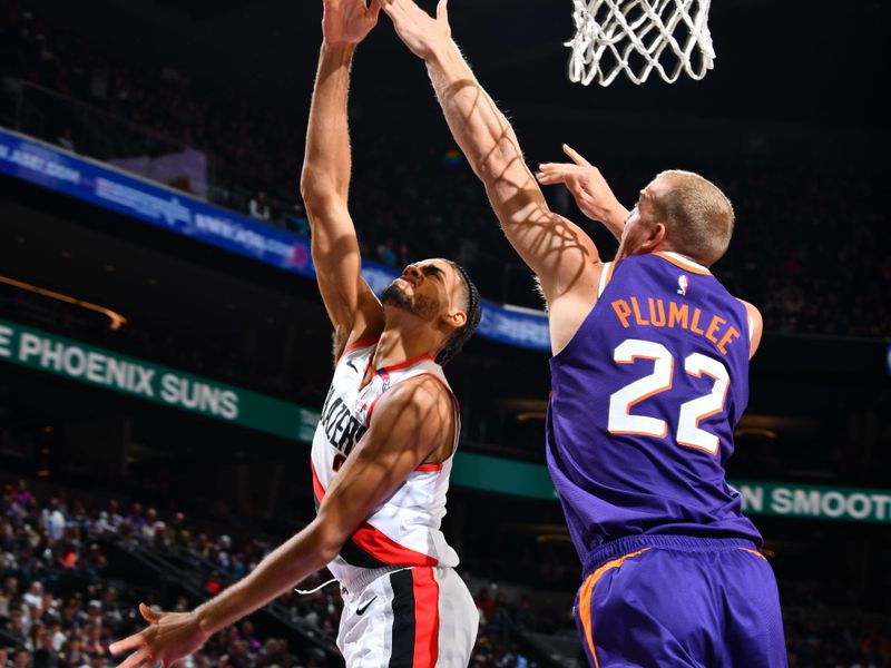 PHOENIX, AZ - NOVEMBER 2: Rayan Rupert #21 of the Portland Trail Blazers drives to the basket during the game against the Phoenix Suns on November 2, 2024 at Footprint Center in Phoenix, Arizona. NOTE TO USER: User expressly acknowledges and agrees that, by downloading and or using this photograph, user is consenting to the terms and conditions of the Getty Images License Agreement. Mandatory Copyright Notice: Copyright 2024 NBAE (Photo by Barry Gossage/NBAE via Getty Images)