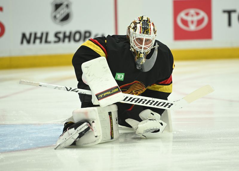 Mar 21, 2026; Vancouver, British Columbia, CAN; Vancouver Canucks goaltender Kevin Lankinen (32) warming up before puck drop against St. Louis Blues at Rogers Arena. Mandatory Credit: Simon Fearn-Imagn Images