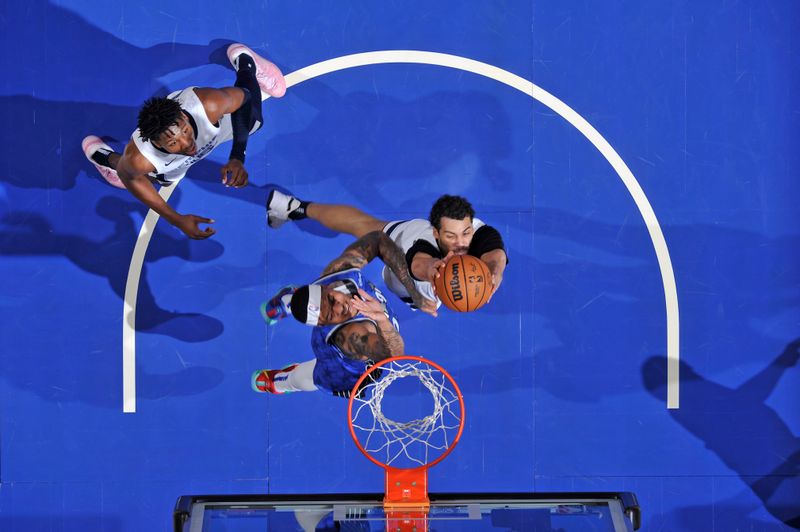 ORLANDO, FL - MARCH 30: Maozinha Pereira #25 of the Memphis Grizzlies drives to the basket during the game against the Orlando Magic on March 30, 2024 at the Kia Center in Orlando, Florida. NOTE TO USER: User expressly acknowledges and agrees that, by downloading and or using this photograph, User is consenting to the terms and conditions of the Getty Images License Agreement. Mandatory Copyright Notice: Copyright 2024 NBAE (Photo by Fernando Medina/NBAE via Getty Images)