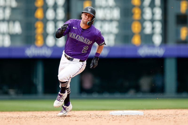 Jun 8, 2025; Denver, Colorado, USA; Colorado Rockies right fielder Tyler Freeman (2) rounds second on a triple in the ninth inning against the New York Mets at Coors Field. Mandatory Credit: Isaiah J. Downing-Imagn Images