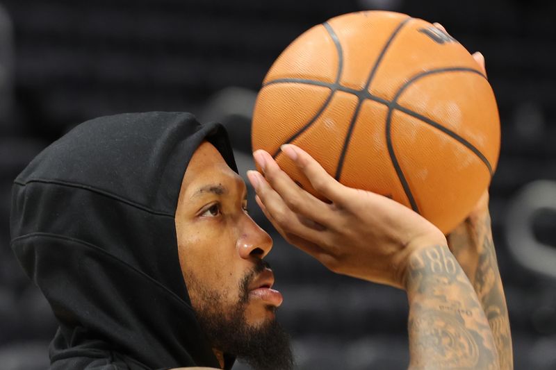 MILWAUKEE, WISCONSIN - NOVEMBER 26: Damian Lillard #0 of the Milwaukee Bucks participates in warmups prior to a game against the Portland Trail Blazers at Fiserv Forum on November 26, 2023 in Milwaukee, Wisconsin. NOTE TO USER: User expressly acknowledges and agrees that, by downloading and or using this photograph, User is consenting to the terms and conditions of the Getty Images License Agreement. (Photo by Stacy Revere/Getty Images)