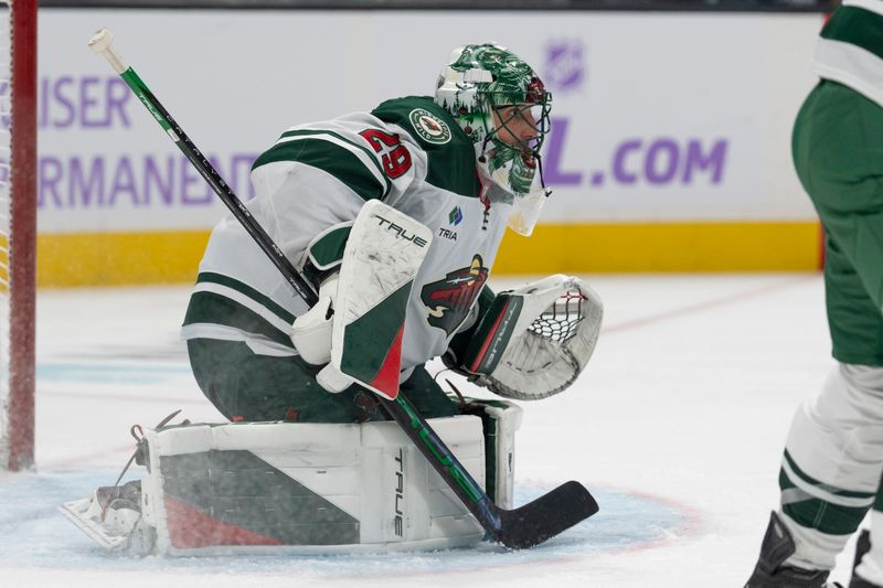 Nov 7, 2024; San Jose, California, USA;  Minnesota Wild goaltender Marc-Andre Fleury (29) watches the puck during the second period against the San Jose Sharks at SAP Center at San Jose. Mandatory Credit: Stan Szeto-Imagn Images