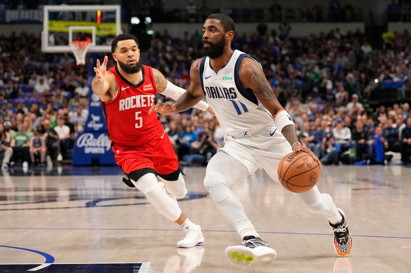 DALLAS, TEXAS - APRIL 07: Kyrie Irving #11 of the Dallas Mavericks is defended by Fred VanVleet #5 of the Houston Rockets during the first half at American Airlines Center on April 07, 2024 in Dallas, Texas. NOTE TO USER: User expressly acknowledges and agrees that, by downloading and or using this photograph, User is consenting to the terms and conditions of the Getty Images License Agreement. (Photo by Sam Hodde/Getty Images)