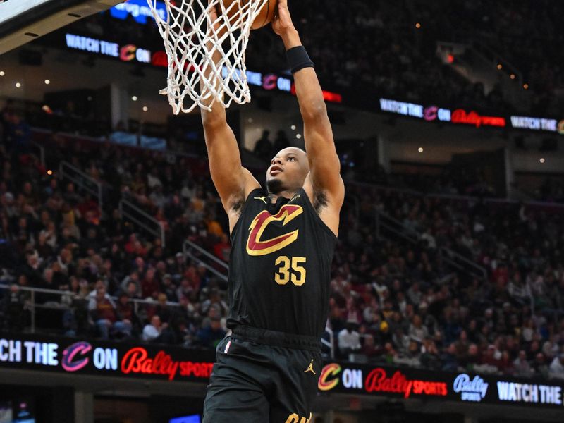 CLEVELAND, OHIO - NOVEMBER 25: Isaac Okoro #35 of the Cleveland Cavaliers dunks during the third quarter against the Los Angeles Lakers at Rocket Mortgage Fieldhouse on November 25, 2023 in Cleveland, Ohio. The Lakers defeated the Cavaliers 121-115. NOTE TO USER: User expressly acknowledges and agrees that, by downloading and or using this photograph, User is consenting to the terms and conditions of the Getty Images License Agreement. (Photo by Jason Miller/Getty Images)