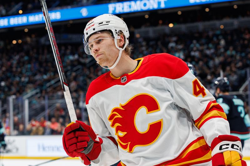 Oct 19, 2024; Seattle, Washington, USA; Calgary Flames center Connor Zary (47) looks on during the second period against the Seattle Kraken at Climate Pledge Arena. Mandatory Credit: Caean Couto-Imagn Images